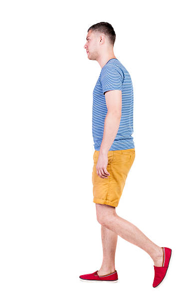 istock Back view of going  handsome man in shorts. 512492775