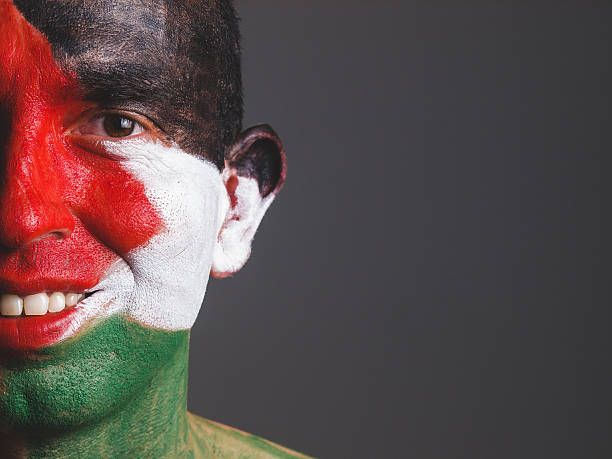 istock Man and his face painted with palestine flag 512493903