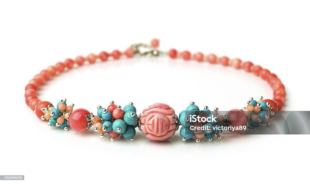 necklace of coral and turquoise lovely necklace of coral and turquoise isolated on white Bead Stock Photo