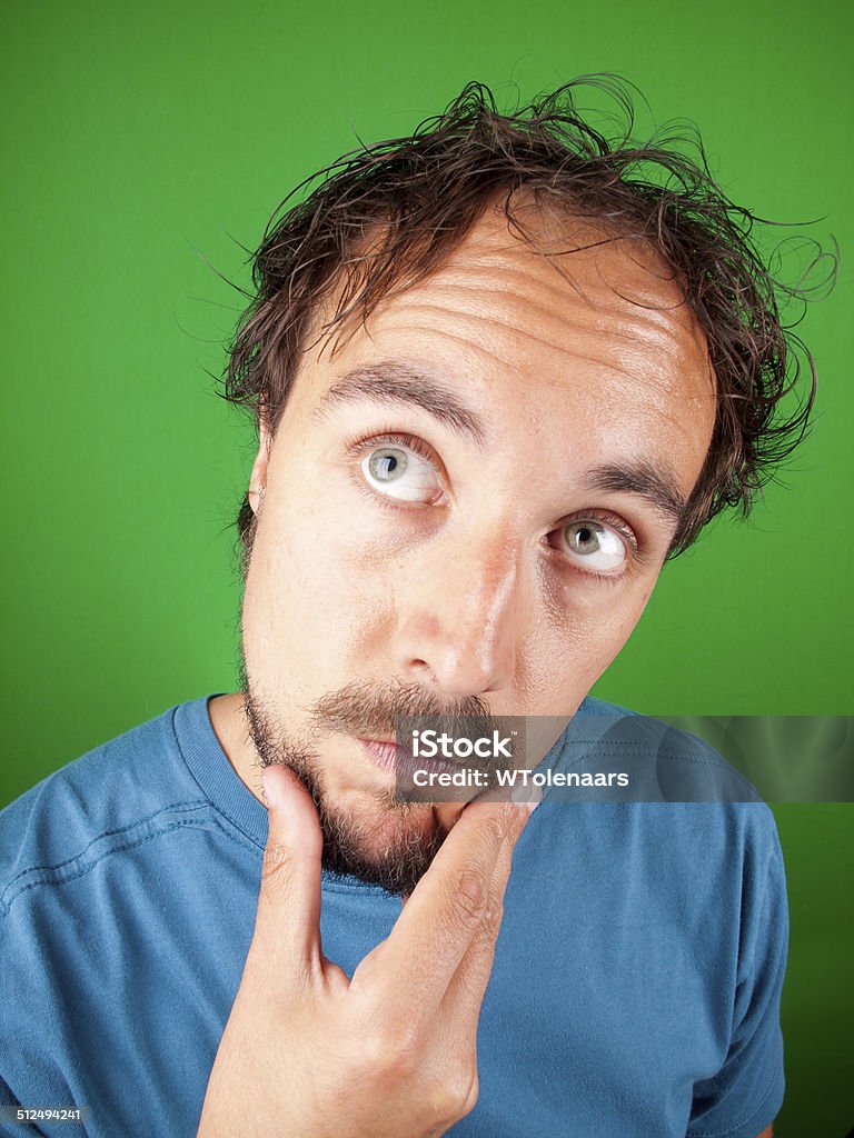 Man Stroking His Chin While In Deep Thoughts Stock Photo ...