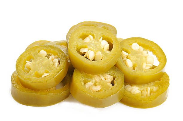 istock pickled sliced green jalapeno peppers on white background 512494291