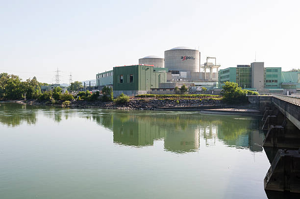 Nuclear power plant Beznau (KKB), Switzerland Beznau, Switzerland - June 8, 2014: Nuclear power plant Beznau, Switzerland (canton Aargau), at the Aare river. Built in 1969, the pressurized water reactor at Beznau is the world's oldest nuclear plant that is still operating. aargau canton photos stock pictures, royalty-free photos & images
