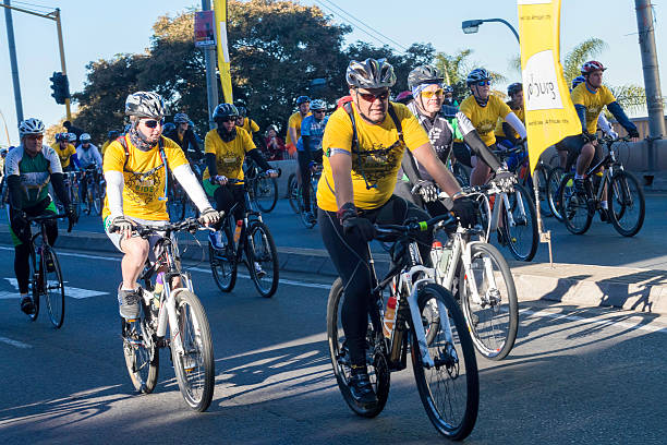 Johannesburg, South Africa - July, 20th 2014: Cyclists on a fundraising ride on Nelson Mandela day riding alongside each other, in Johannesburg city. This race starts from Nelson Mandela Bridge and has become a yearly event.