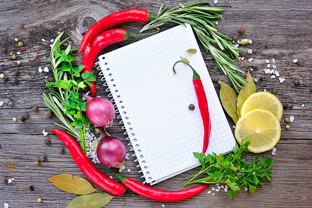 istock Vegetables and seasonings with open notebook for recipes 512495598