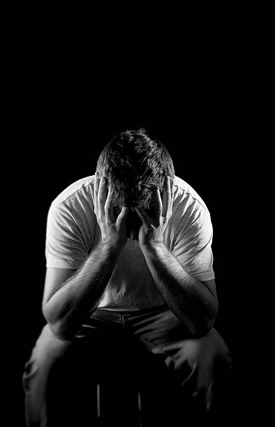 istock desperate man suffering emotional pain, grief and deep depression 512497169
