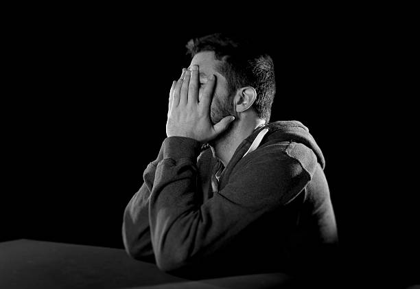 istock desperate man suffering emotional pain, grief and deep depression 512497177