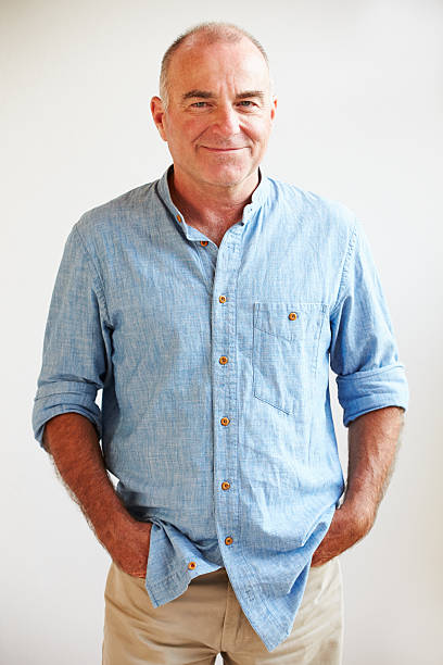 istock Portrait Of Middle Aged Man Standing By Wall 512498529