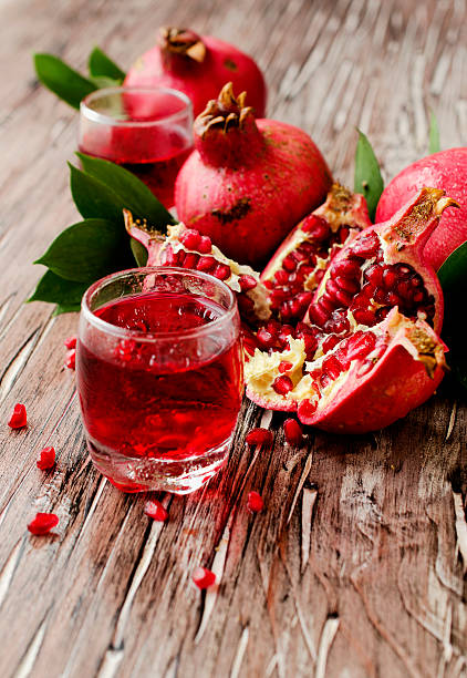 istock Fresh pomegranates and juice, selective focus 512506378