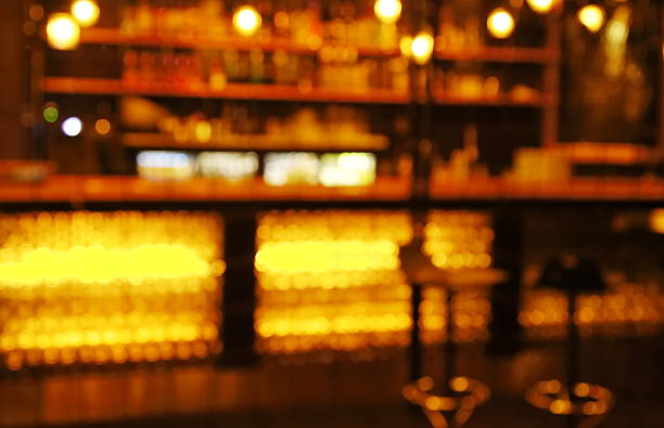 istock blur stools at counter in  bar  at dark night 512508126
