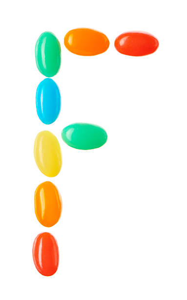 istock F letter made of multicolored candies isolated on white 512508982