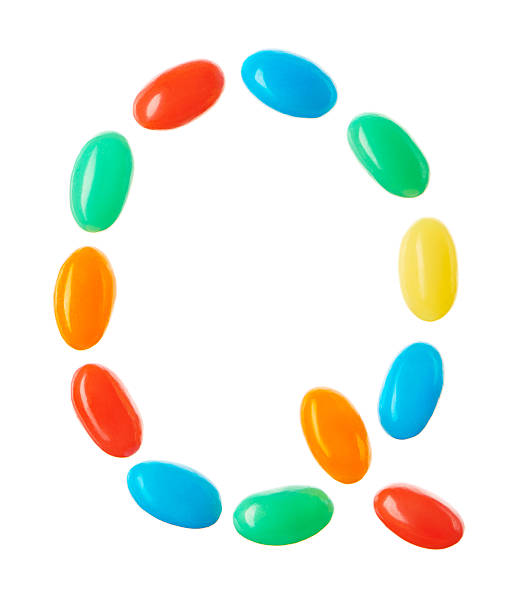istock Q letter made of multicolored candies isolated on white 512509040