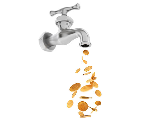 istock Golden Coin Coming Out From Chrome Water Tap 512509698