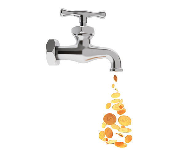 istock Golden Coin Coming Out From Chrome Water Tap 512509710