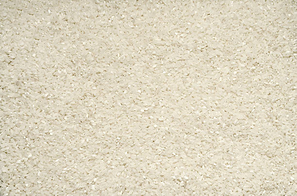 istock Textured background of rice grains on the surface 512510094