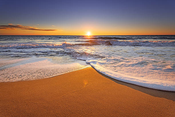 istock Brilliant ocean beach sunrise. 512510780