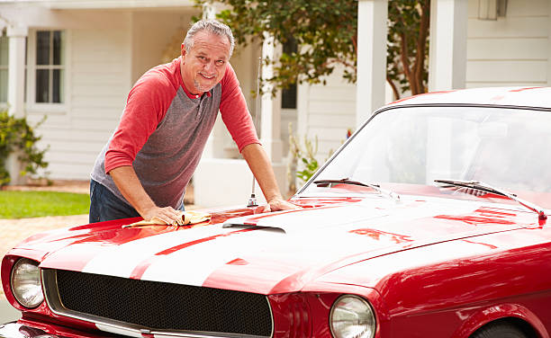 istock Retired Senior Man Cleaning Restored Classic Car 512518979