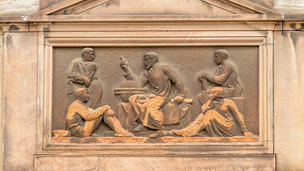 istock Art Deco inspired classical relief of a teacher 512519909