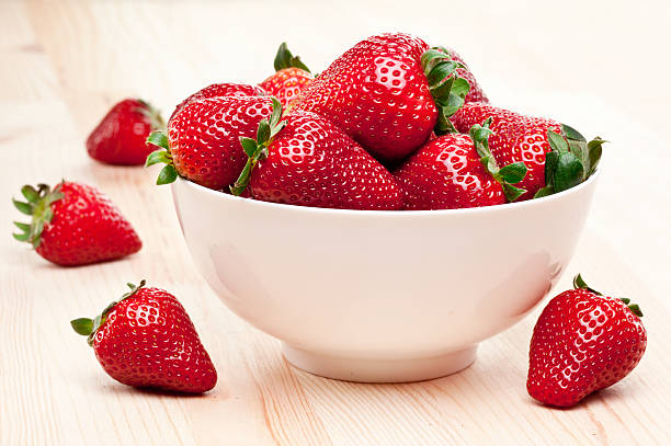 Appetizing strawberry. Appetizing strawberry in the bowl on a white background. Strawberries stock pictures, royalty-free photos & images