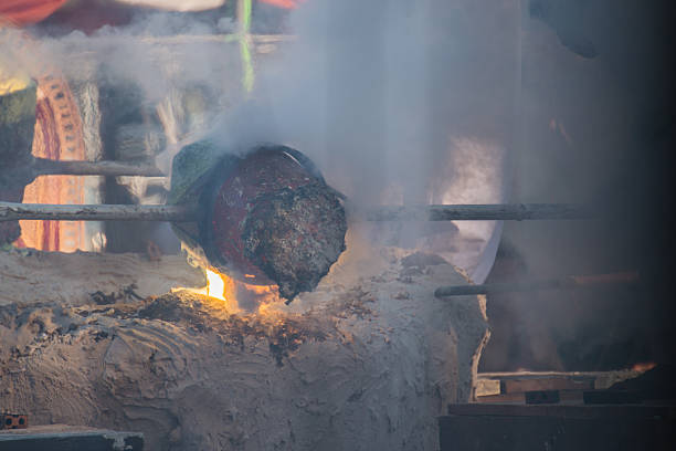 istock Molten Gold being poured into Buddha statue moulds 512521622