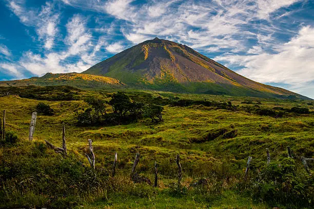 The warm coloured evening sun gracing the volcanic mount Pico on the island of Pico-Azores-Portugal.jpg