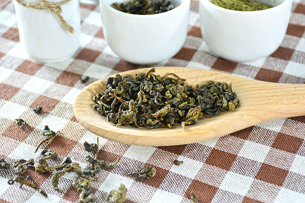 istock Close up dry tea on wooden spoon. 512523235