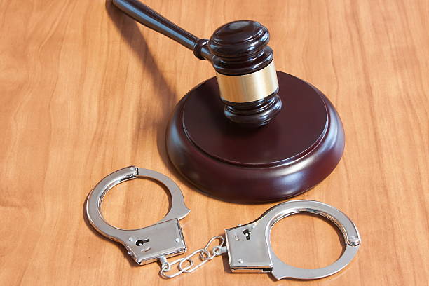 istock Judicial hammer and handcuffs 512523322