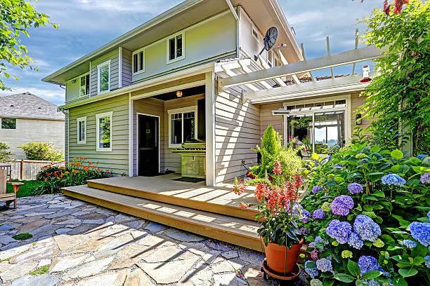 istock Cozy walkout deck with pergola and blooming flowers 512523947