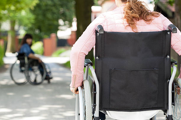 istock Disabled female friends after meeting 512524279