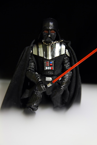 Vancouver, Canada - January 25, 2016:  A Darth Vader figurine from the Hasbro line of Black Series Star Wars toys. Darth Vader, once the Jedi Knight Anakin Skywalker, was a terrifying Sith Lord who ruled during the Galactic Civil War. He was the father of Luke Skywalker and Leia Organa. Ultimately it was Darth Vader's redemption that saved Luke from the evil plans of Emperor Palpatine and allowed the Jedi to be reborn