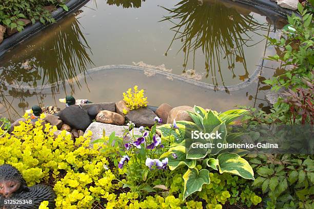 Beautiful Landscape Design In A Garden Stock Photo - Download Image Now - Day, Flower, Flowerbed