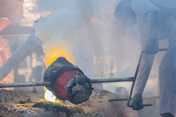 istock Molten Gold being poured into Buddha statue moulds 512525738