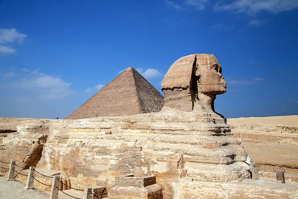 The famous Sphinx with the Great Pyramid of Cheops as background.