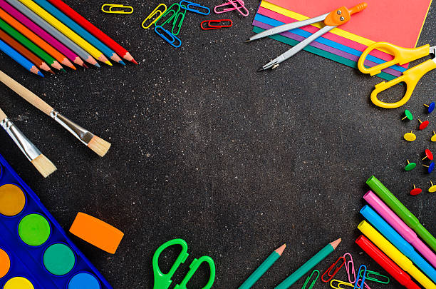 istock School supplies on dark table 512527398
