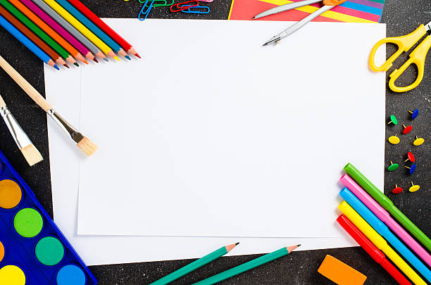 School supplies on dark table