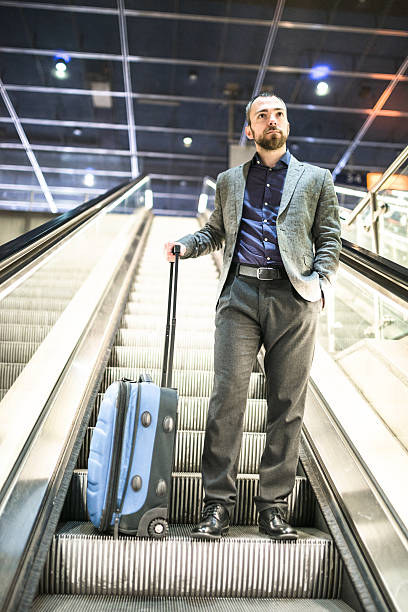 istock businessman waiting the train platform at the station 512535638