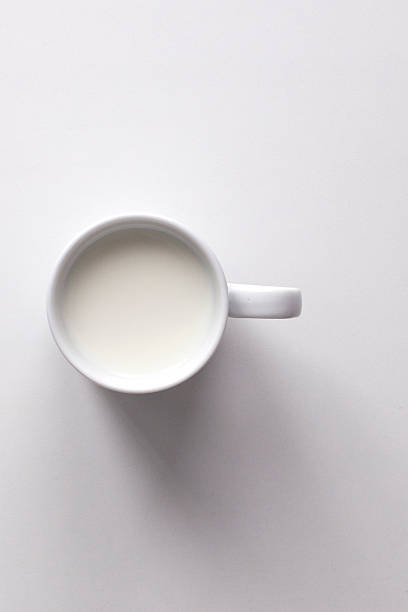 istock Mug of milk on white background 512536880