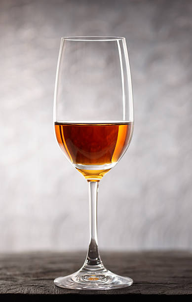 Glass of amontilliado sherry on wooden plank Glass of amontilliado sherry-jerez wine on wooden plank sherry stock pictures, royalty-free photos & images