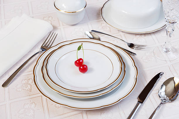istock Two cherries lie on a white porcelain plate 512541822