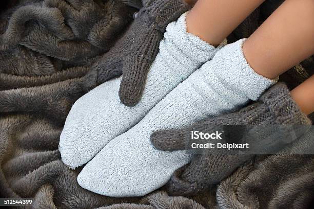 Feet In Comfortable And Warm Woolen Stocks On A Blanket Stock Photo - Download Image Now