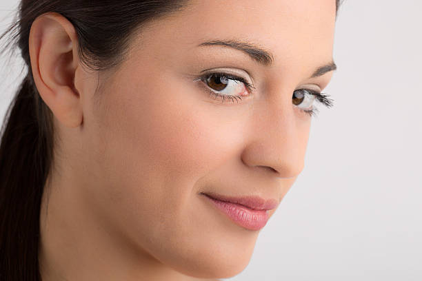 istock Closeup Pretty woman looking at camera 512546837