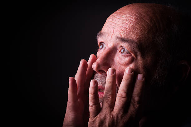 istock old man looking frighten or scared 512548223