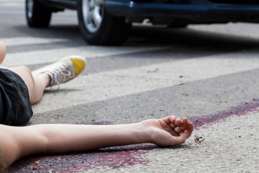 Close-up of unconscious woman at accident scene