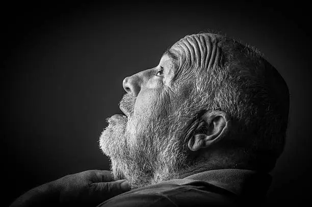old man choking looking up