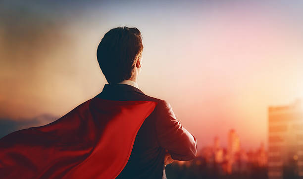 istock superhero businessman looking at city 512549462