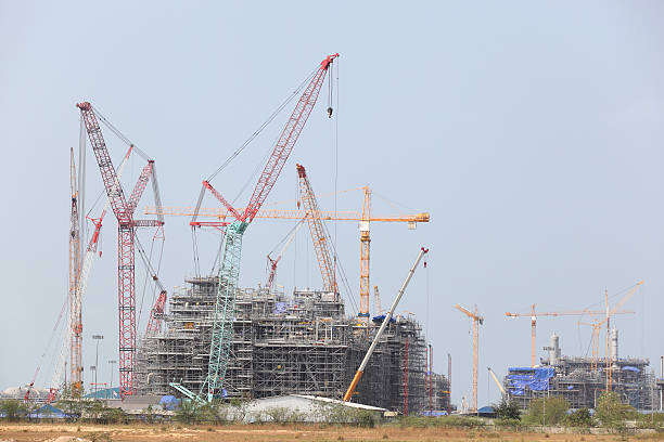 istock Chemical plant under construction with big crane 512550352
