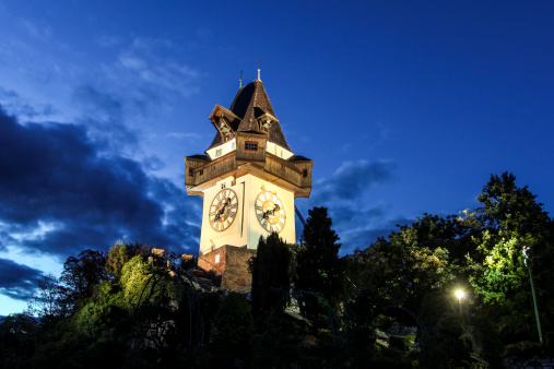 Clock tower Uhrthurm on Schlossberg fort at night (Graz, Austria)