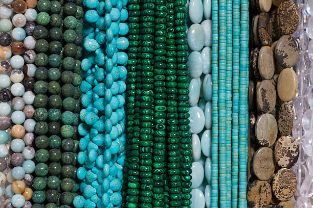 istock Bright Beads and Necklaces Hanging in Shop (Close-Up) 512551265