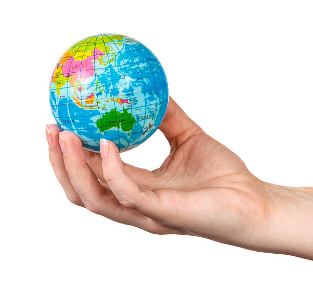 istock small model of the globe in the hand 512551454