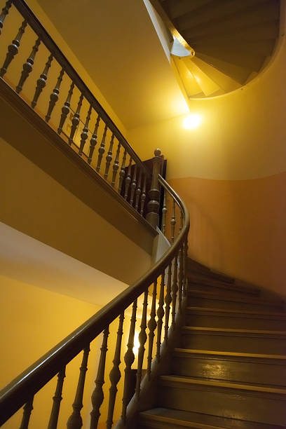 istock historic staircase with yellow walls 512551693
