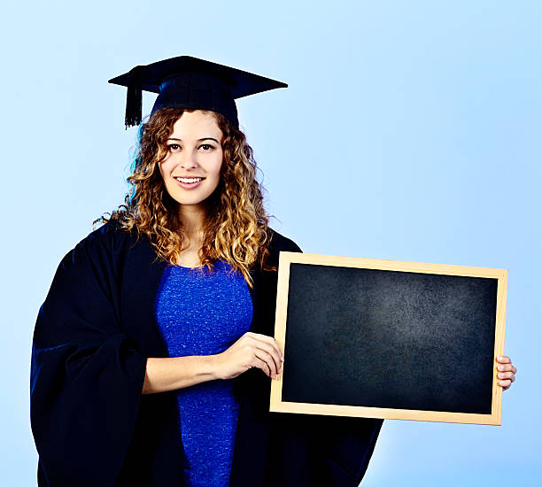 istock Young graduate says write your own future with a degree! 512551851